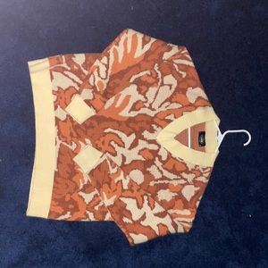 small orange and crème v-neck sweater from Cider